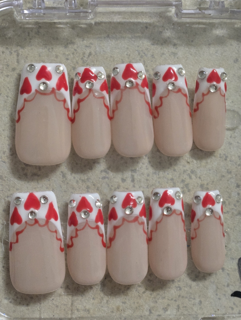 Nude Press-On Nails with Red Heart Tips and Rhinestones, Medium Length Square